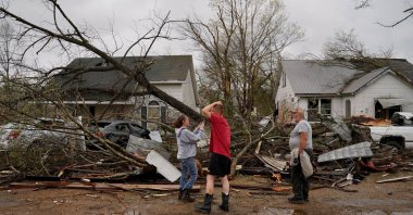 People react as they see the wreckage of their home in the aftermath of a tornado, in Glenallen, Missouri, U.S., April 5, 2023. (Reuters Photo)