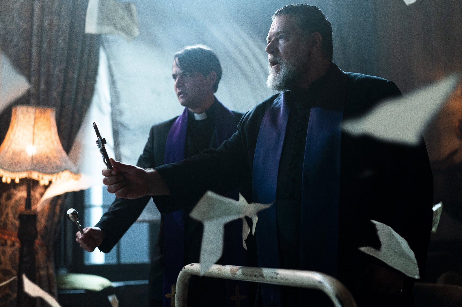 This image released by Sony Pictures shows Daniel Zovatto (L) and Russell Crowe in a scene from Screen Gems&#039; &quot;The Pope&#039;s Exorcist.&quot; (AP Photo)