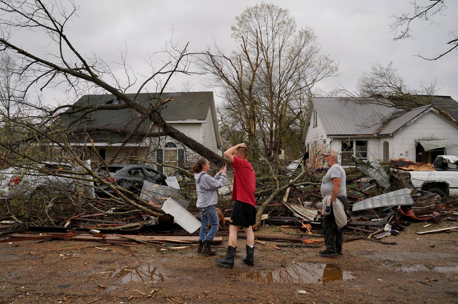 People react as they see the wreckage of their home in the aftermath of a tornado, in Glenallen, Missouri, U.S., April 5, 2023. (Reuters Photo)