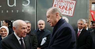 MHP leader Devlet Bahçeli (L) shakes hands with President Recep Tayyip Erdoğan during an event in Elazığ, southeastern Türkiye, April 1, 2023. (AA Photo)