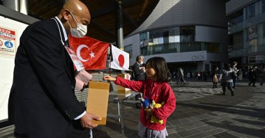 Volunteers collect donations for the victims of the deadly Feb. 6 earthquakes that struck Türkiye in Tokyo, Japan, March 11, 2023. (AA Photo)