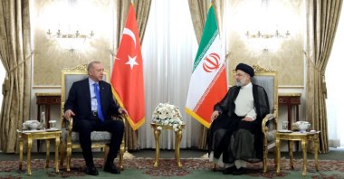 President Recep Tayyip Erdoğan (L) talks to Iranian President Ebrahim Raisi (R) during a meeting in Tehran, Iran, July 19, 2022. (EPA Photo)