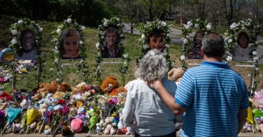 People visit a makeshift memorial at the entrance of The Covenant School in Nashville, Tennessee, U.S., April 1, 2023. (AFP Photo)