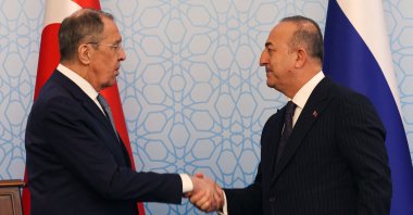Foreign Minister Mevlüt Çavuşoğlu (R) shakes hands with his Russian counterpart Sergey Lavrov following their joint news conference following talks in Ankara, Türkiye, April 7, 2023. (AFP Photo)