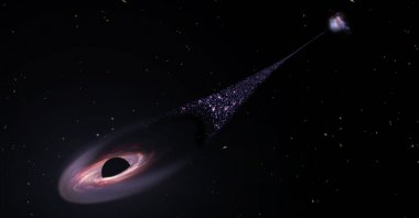 An illustration depicts a runaway supermassive black hole that was ejected from its host galaxy as a result of a tussle between it and two other black holes. (AFP Photo)