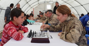Gendarmerie personnel play chess with children in Adıyaman, Türkiye, April 8, 2023. (AA Photo)