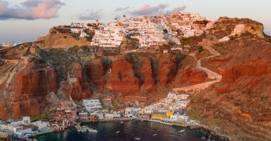 A view of the Amoudi Bay at Sunset, Oia, Santorini Island, Greece.