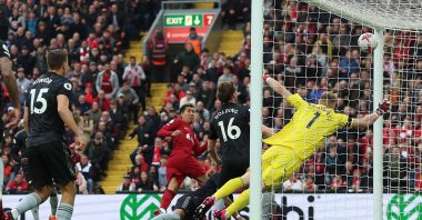 Liverpool's Roberto Firmino scores their second goal during EPL match against Arsenal at Anfield, Liverpool, U.K., April 9, 2023. (Reuters Photo)