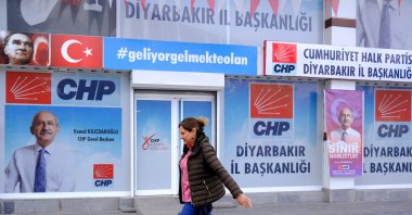 A woman walks past a picture of Republican People’s Party (CHP) leader and presidential candidate Kemal Kılıçdaroğlu in Diyarbakır, Türkiye, March 20, 2023. (EPA Photo)
