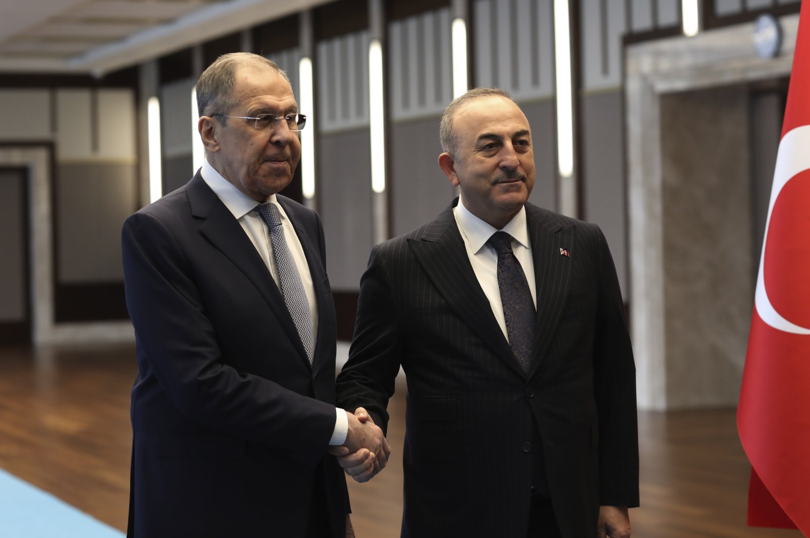 Turkish Foreign Minister Mevlüt Çavuşoğlu, right, and his Russian counterpart Sergei Lavrov shake hands before their talks, in Ankara, Türkiye, Friday, April 7, 2023. (AP File Photo)