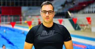 Swimming coach/lawyer Çelik Erimez poses for a photo at the Yenikent Olympic Swimming Pool, Eskişehir, Türkiye, April 9, 2023. (AA Photo)