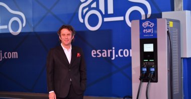 Board Chairperson of Eşarj and Enerjisa Enerji CEO Murat Pınar poses in front of a Eşarj station in Istanbul, Türkiye, March 31, 2023. (IHA Photo)