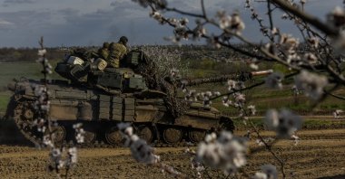A tank moves on the road, at an undisclosed location near Bakhmut, Donetsk region, Ukraine, April, 10, 2023. (EPA Photo)
