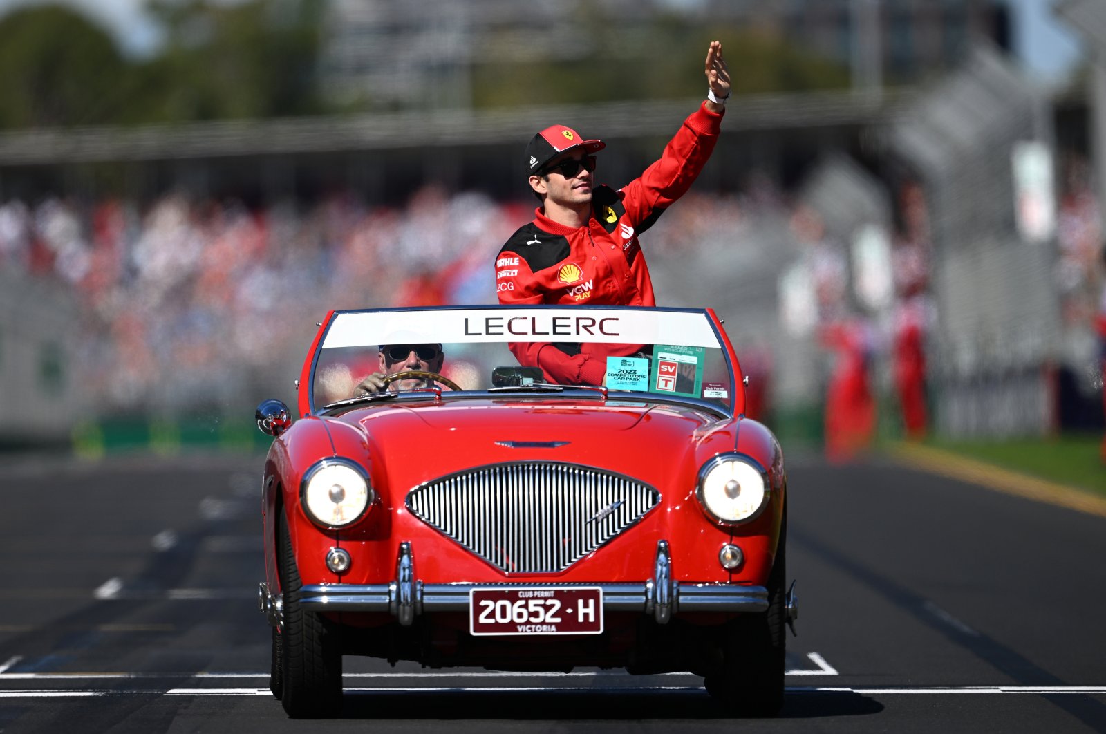 Monacan Ferrari driver Charles Leclerc waves to spectators during a drivers parade ahead of the the 2023 Australian Grand Prix at the Albert Park Circuit, Melbourne, Australia, April 2, 2023. (EPA Photo)