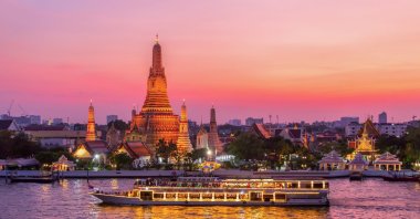 Wat Arun and a cruise ship are seen in Bangkok, Thailand. (Getty Images Photo)