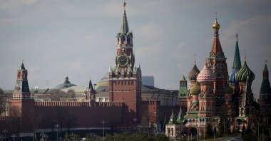 A view of the Kremlin with Spasskaya Tower (C) and St. Basil's Cathedral (R) in downtown Moscow, Russia, April 1, 2023. (AFP Photo by Natalia KOLESNIKOVA / AFP)