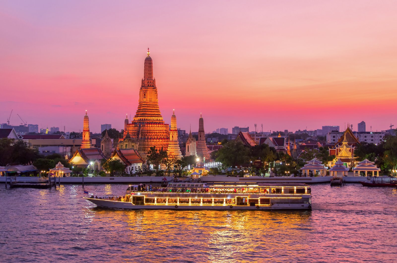 Wat Arun and a cruise ship are seen in Bangkok, Thailand. (Getty Images Photo)