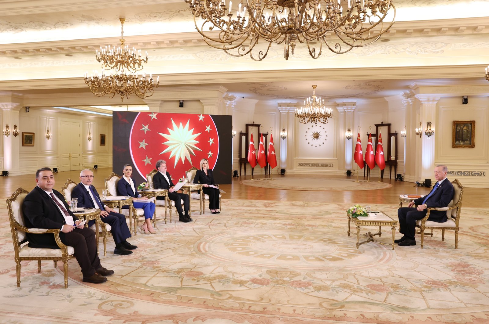 President Recep Tayyip Erdoğan answers questions on a live interview with CNN Türk, April 12, 2023. (AA Photo)