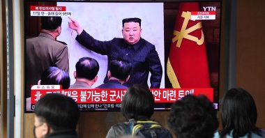 People watch a television screen showing a news broadcast with file footage of North Korean leader Kim Jong Un, at a railway station in Seoul, South Korea, April 13, 2023. (AFP Photo)