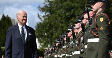 U.S. President Joe Biden (L) inspects the Guard of Honor at the Aras an Uachtarain in Dublin during his four-day trip to Northern Ireland and Ireland to commemorate the 25th anniversary of the &quot;Good Friday Agreement,&quot; April 13, 2023. (AFP Photo)