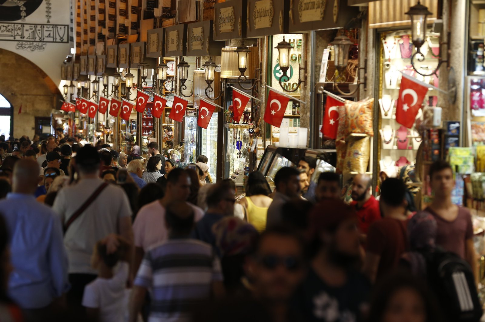 People stroll at the Grand Bazaar, known as the Covered Bazaar, Istanbul, Türkiye, Aug. 20, 2018. (AP Photo)