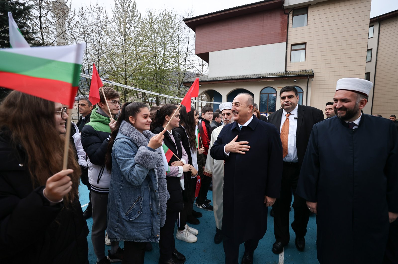 Foreign Minister Mevlüt Çavuşoğlu greets high school students during a visit in Shuman, Bulgaria, April 12, 2023. (AA Photo)