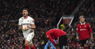 Sevilla&#039;s Lucas Ocampos (L) celebrates their side&#039;s first goal of the game, an own goal from Manchester United&#039;s Tyrell Malacia during the Europa League quarterfinal first leg match at Old Trafford, Manchester, U.K., April 13, 2023. (AP Photo)