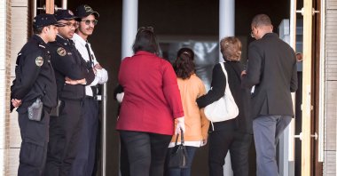 A young Moroccan girl (orange jacket) who was repeatedly raped when she was 11-years old, enters the tribunal before the trial of three men accused of the sexual aggression, Rabat, Morocco, April 13, 2023. (AFP Photo)