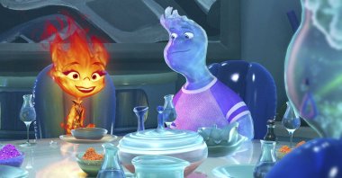 Ember (L) voiced by Leah Lewis, and Wade voiced by Mamoudou Athie, in a scene from the animated film "Elemental." (AP Photo)