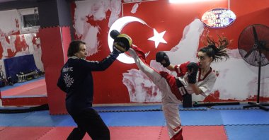 Türkiye's national kickboxer Aybüke Kılınç (R) in action during training with her coach, Osmaniye, Türkiye, April 13, 2023. (AA Photo)