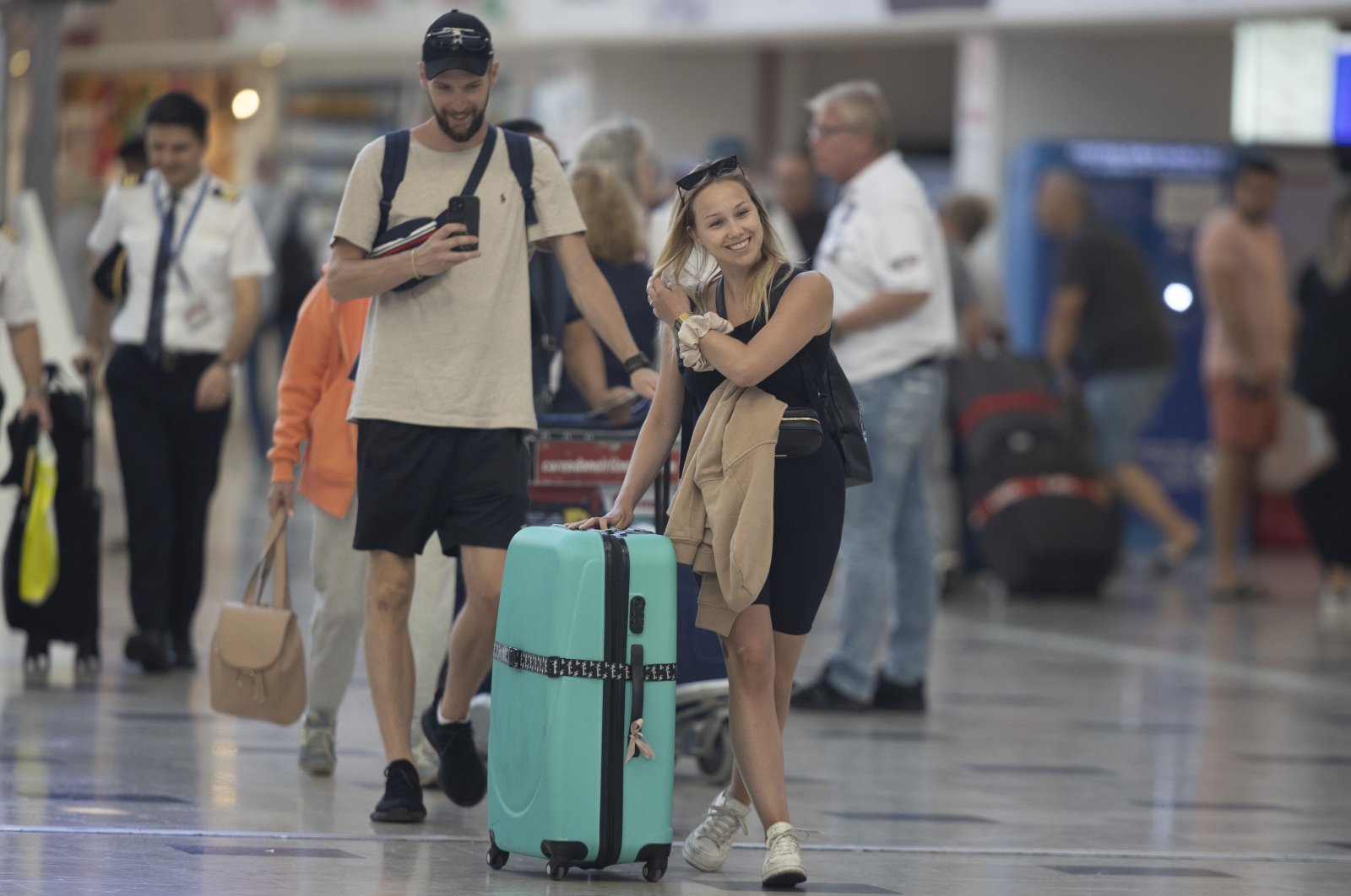 Tourists walk through Fraport TAV Antalya Airport, which is among the busiest airports in Europe and served more than 23 million passengers from 50 countries in 8.5 months in 2022, Antalya, Türkiye, Sept. 21, 2022. (AA Photo)