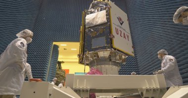 Scientists inspect Türkiye's new satellite IMECE at Vandenberg Space Force Base, in California, U.S., April 14, 2023. (AA Photo)