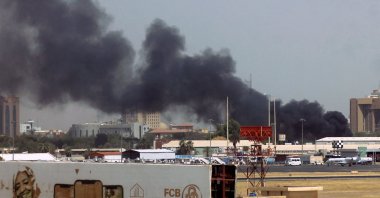 Heavy smoke bellows above buildings in the vicinity of the Khartoum airport, in Khartoum, Sudan, April 15, 2023. (AFP Photo)