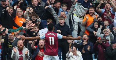 Aston Villa's Ollie Watkins (C) celebrates in front of fans after scoring, during Premier League football match between Aston Villa and Newcastle United, at Villa Park, in Birmingham, U.K., April 15, 2023. (AFP Photo)
