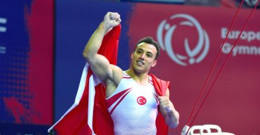 Turkish gymnast Adem Asil celebrates after winning the 10th European Artistic Gymnastics Championships double, Antalya, Türkiye, April 15, 2023. (AA Photo)