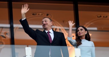 Azerbaijan&#039;s President Ilham Aliyev (L) and first lady Mehriban Aliyeva waving at spectators at the Baku 2015 European Games, Baku, Azerbaijan, June 28, 2015.  (Getty Images Photo)