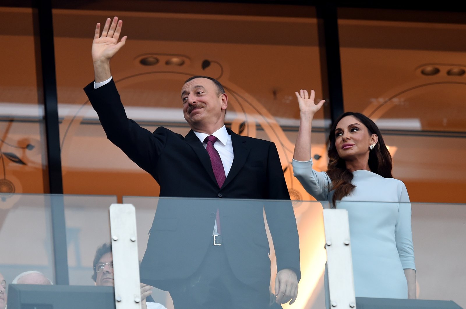 Azerbaijan&#039;s President Ilham Aliyev (L) and first lady Mehriban Aliyeva waving at spectators at the Baku 2015 European Games, Baku, Azerbaijan, June 28, 2015.  (Getty Images Photo)