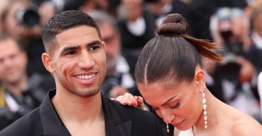 Achraf Hakimi (L) and Hiba Abouk attend the 75th Anniversary celebration screening of "The Innocent (L'Innocent)" during the 75th annual Cannes film festival at Palais des Festivals, Cannes, France, May 24, 2022. (Getty Images Photo)