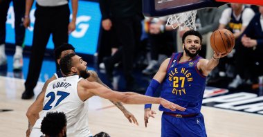 Denver Nuggets guard Jamal Murray (R) drives to the net against Minnesota Timberwolves center Rudy Gobert (L) in the third quarter during Game 1 of the 2023 NBA Playoffs at Ball Arena, Denver, U.S., April 16, 2023. (Reuters Photo)