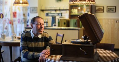 A man sits next to a gramophone at the Grassi Museum, in Saxony, Leipzig, Germany, Dec. 8, 2022. (Getty Images Photo)