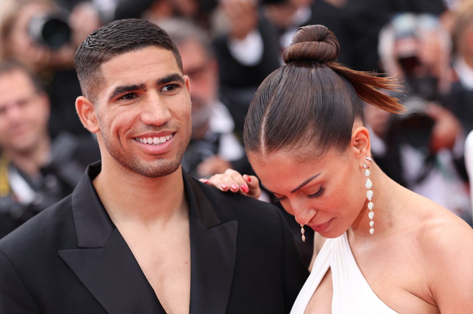 Achraf Hakimi (L) and Hiba Abouk attend the 75th Anniversary celebration screening of &quot;The Innocent (L&#039;Innocent)&quot; during the 75th annual Cannes film festival at Palais des Festivals, Cannes, France, May 24, 2022. (Getty Images Photo)