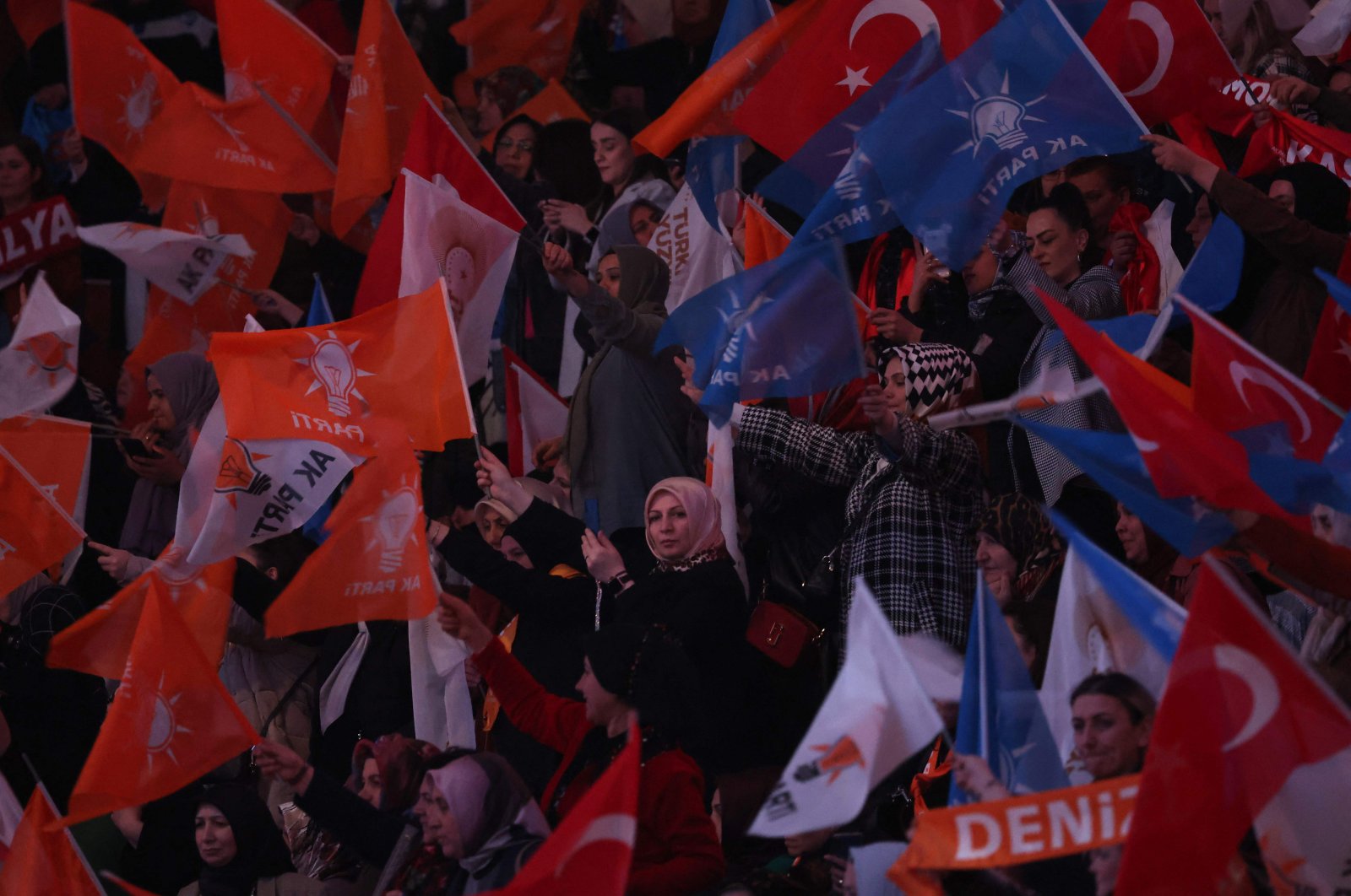 Party members wave the Turkish flag and party flags at the ruling Justice and Development Party&#039;s (AK Party) election manifesto announcement ceremony in the capital Ankara, Türkiye, April 11, 2023. (AFP Photo)