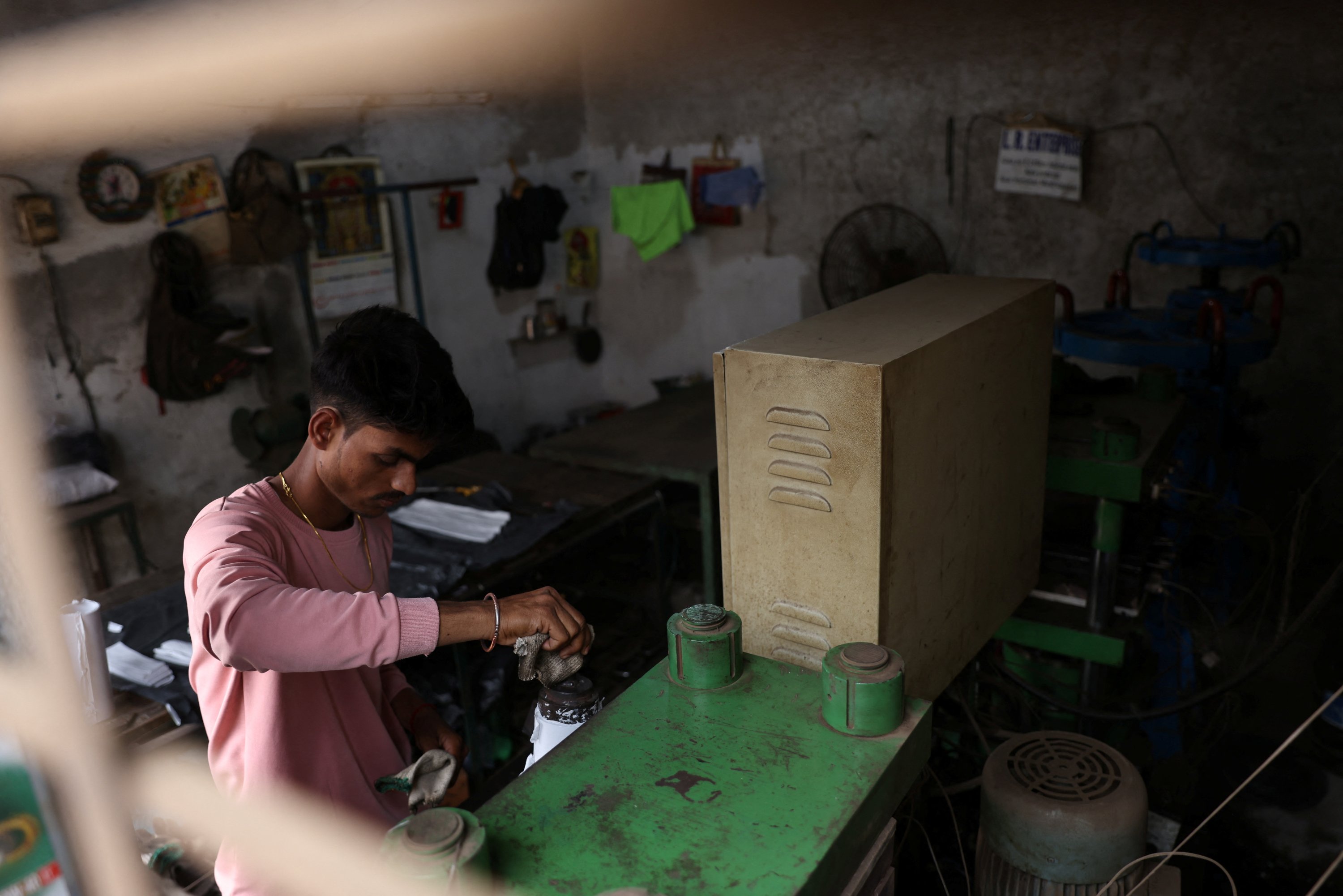 A 21-year-old aspiring college student and migrant worker Sujeet Kumar works at his brother-in-law Sunil Kumar's factory which manufactures rubber sealants for pressure cookers, on the outskirts of Mumbai, India, March 13, 2023. (Reuters Photo)