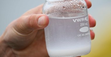 A researcher holds a sample of collected carbon in the solid form of calcium carbonate and magnesium hydroxide during a briefing, in San Pedro, California, U.S., April 12, 2023. (AFP Photo)