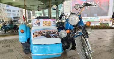 The 1971 model blue motorcycle that was used in Yeşilçam movies goes up for sale to benefit quake survivors, Istanbul, Türkiye, April 16, 2023. (IHA Photo)
