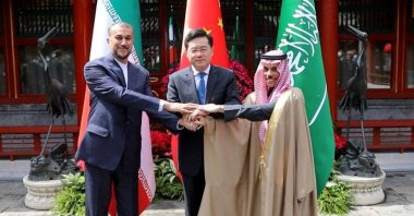 Iran&#039;s Foreign Minister Hossein Amirabdollahian (L) shaking hands with Saudi Foreign Affairs Minister Prince Faisal bin Farhan (R) and Chinese Foreign Minister Qin Gang during a meeting in Beijing, China, April 6, 2023.