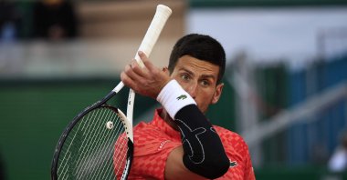 Serbia's Novak Djokovic reacts during his match against Italy's Lorenzo Musetti at the  Monte-Carlo ATP Masters Series tournament round of 16 tennis match, Monte Carlo, Monaco, April 13, 2023. (AFP Photo)