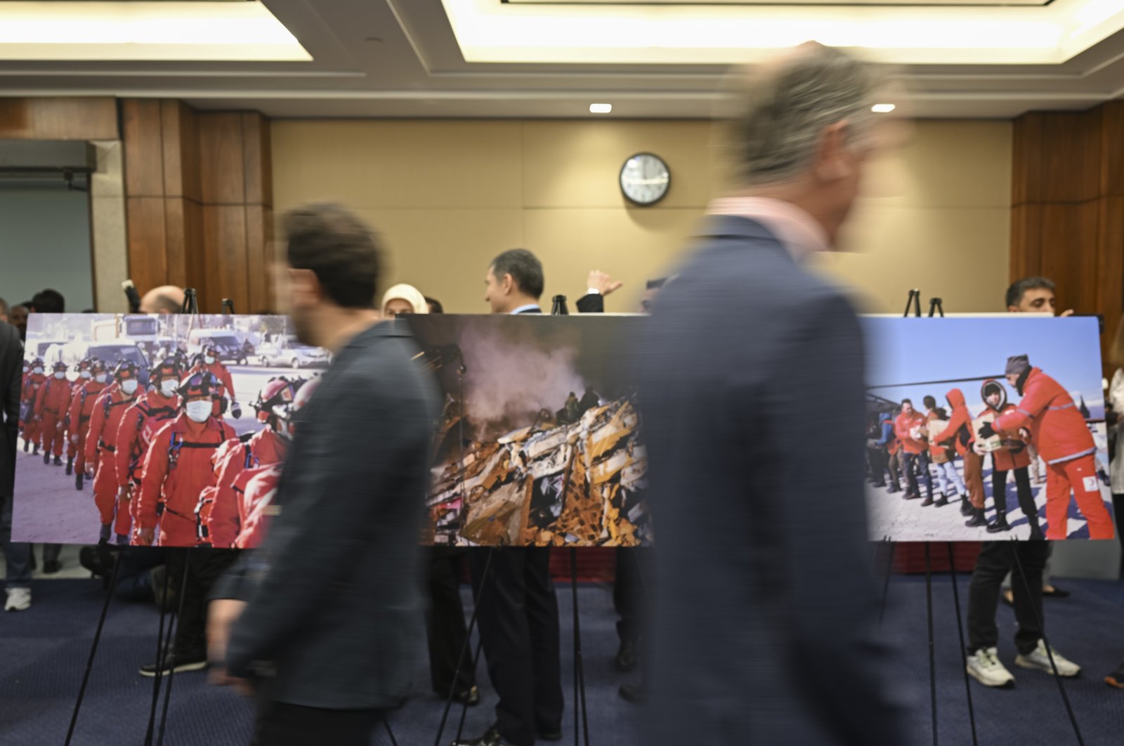 Spectators look on at a photography exhibition featuring Türkiye’s earthquake-hit areas in Washington, U.S., April 17, 2023. (AA Photo) 
