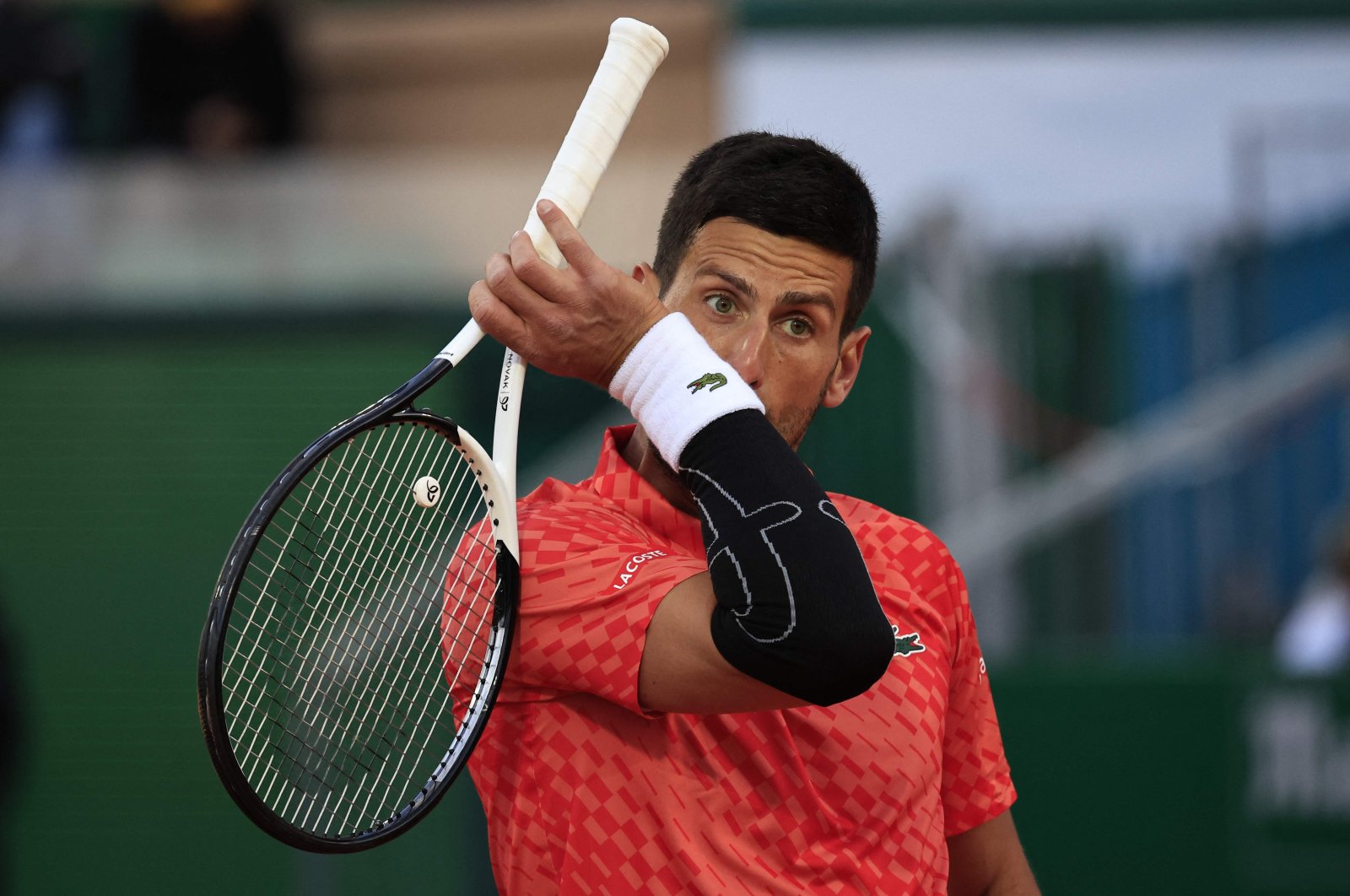 Serbia&#039;s Novak Djokovic reacts during his match against Italy&#039;s Lorenzo Musetti at the  Monte-Carlo ATP Masters Series tournament round of 16 tennis match, Monte Carlo, Monaco, April 13, 2023. (AFP Photo)
