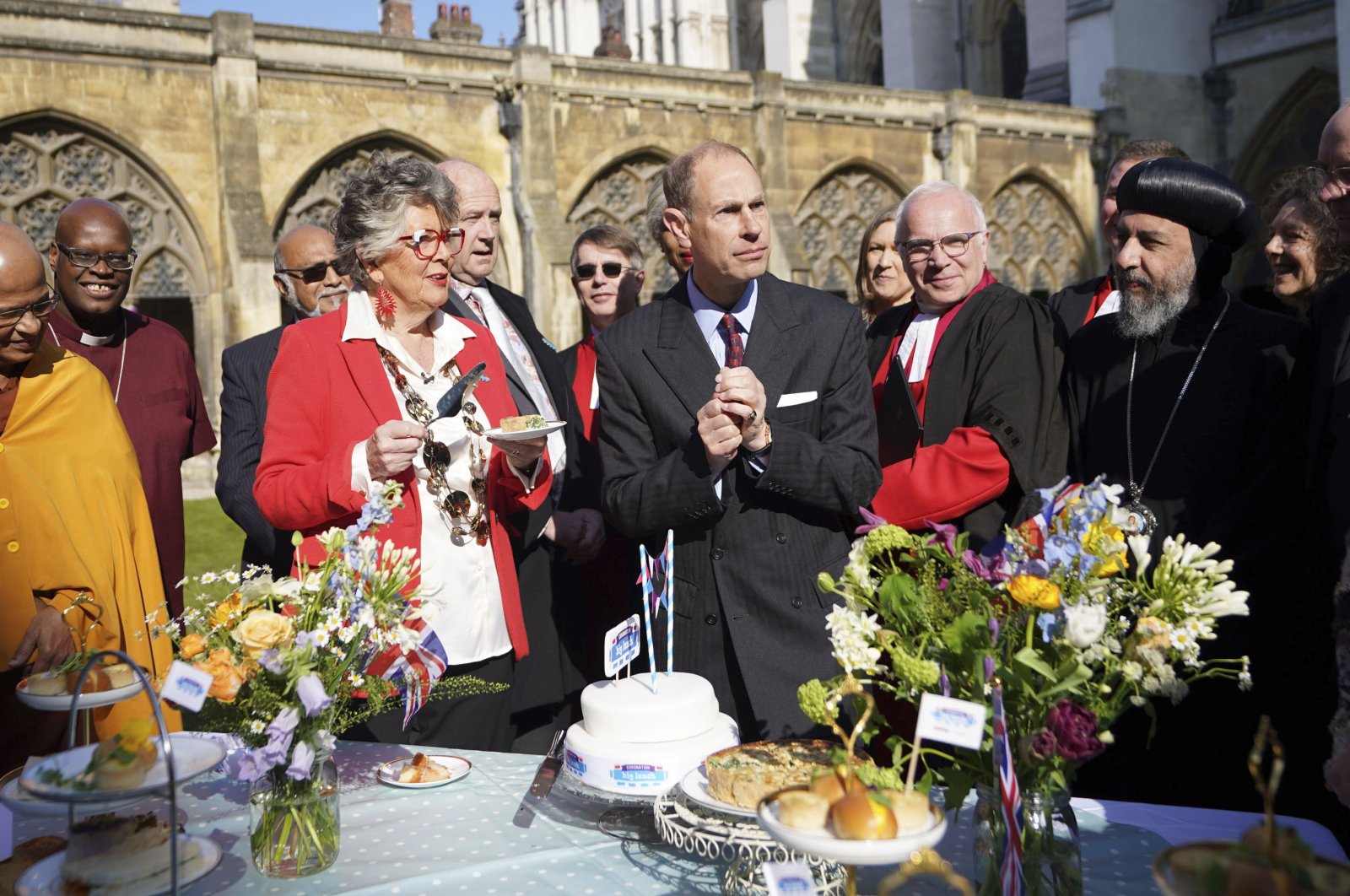 Prince Edward, Duke of Edinburg, tries the official coronation quiche at a Coronation Big Lunch hosted by the Archbishop of Canterbury, at Westminster Abbey, in London, U.K., April 18, 2023. (AP Photo)
